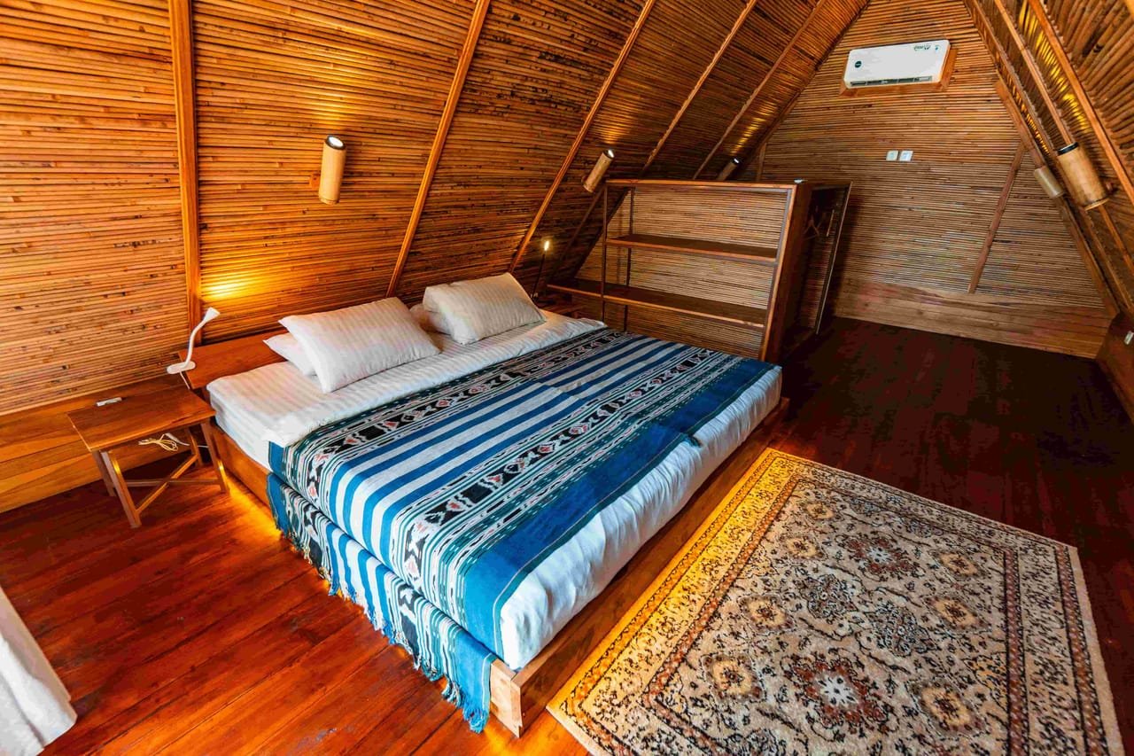 Upstairs master bedroom with king bed and sea-facing windows